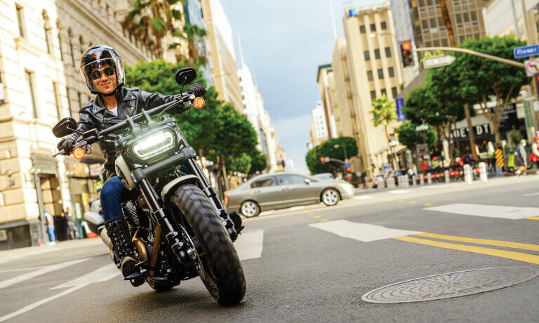 Person riding a Harley-Davidson Fat Bob 114 head on in the city