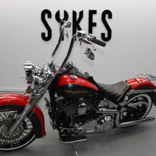 2006 Harley-Davidson FLSTN Softail Deluxe in Red and Grey thumb 1